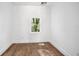 Cozy bedroom with hardwood floors and a window offering natural light at 415 W Church St, Deland, FL 32720