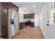 Well-equipped kitchen featuring stainless steel appliances, modern cabinets, and hardwood floors at 415 W Church St, Deland, FL 32720