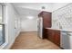 Open-concept kitchen with stainless steel appliances, hardwood floors, and ample natural light at 415 W Church St, Deland, FL 32720