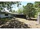 Large backyard featuring mature trees, a playset, a shed, and a screened sunroom at 421 Hope Ter, Maitland, FL 32751