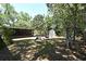 Expansive backyard with a playset, storage shed, and plenty of space for outdoor activities at 421 Hope Ter, Maitland, FL 32751