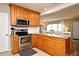 Modern kitchen with stainless appliances, custom cabinets, granite countertops, and an open layout at 421 Hope Ter, Maitland, FL 32751