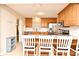 Modern eat-in kitchen with stainless steel appliances, granite countertops, and wooden cabinets at 421 Hope Ter, Maitland, FL 32751