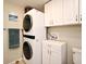 Laundry room featuring a stacked washer dryer at 421 Hope Ter, Maitland, FL 32751