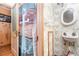 Small bathroom featuring a white sink, floral wallpaper, and a doorway with a shower curtain at 4293 Cypress Bnd, Geneva, FL 32732