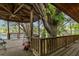 A gazebo with wooden railings, wooden floor and view of the river at 4293 Cypress Bnd, Geneva, FL 32732