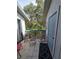 Comfortable outdoor balcony space featuring seating and views of lush greenery at 4401 Sea Mist Dr # 201, New Smyrna Beach, FL 32169
