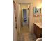 Cozy bathroom leading to a bedroom featuring tile flooring and a single sink vanity at 4401 Sea Mist Dr # 201, New Smyrna Beach, FL 32169