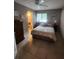 Cozy bedroom featuring a ceiling fan, closet, and ensuite bathroom at 4401 Sea Mist Dr # 201, New Smyrna Beach, FL 32169