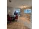 Inviting dining room showcasing tile flooring and natural light from a window at 4401 Sea Mist Dr # 201, New Smyrna Beach, FL 32169