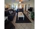 Spacious living room offers tile floors, ample seating, and an inviting atmosphere at 4401 Sea Mist Dr # 201, New Smyrna Beach, FL 32169
