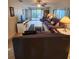 Comfortable living room with tile floors, sofas, and sliding glass doors to the outside at 4401 Sea Mist Dr # 201, New Smyrna Beach, FL 32169
