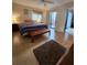 Serene main bedroom featuring tile floors, ceiling fan, and access to a private patio at 4401 Sea Mist Dr # 201, New Smyrna Beach, FL 32169