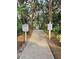 Picturesque walkway leading to the beautiful Atlantic Ocean, surrounded by lush greenery and natural beauty at 4401 Sea Mist Dr # 201, New Smyrna Beach, FL 32169