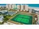 Aerial view of tennis courts and the ocean with the condominium complex in the background at 4505 S Atlantic Ave # 505, Ponce Inlet, FL 32127