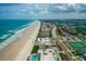 Aerial view of beachfront condos along the coast, highlighting the proximity to the beach and oceanfront living at 4505 S Atlantic Ave # 505, Ponce Inlet, FL 32127