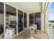 Balcony view with comfortable seating and sliders leading indoors at 4505 S Atlantic Ave # 505, Ponce Inlet, FL 32127
