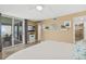 Bright bedroom with a private balcony, television and an ensuite bathroom at 4505 S Atlantic Ave # 505, Ponce Inlet, FL 32127
