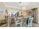 Charming dining area with views of the modern, white kitchen at 4505 S Atlantic Ave # 505, Ponce Inlet, FL 32127