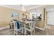 Cozy dining area with views of the modern, open kitchen at 4505 S Atlantic Ave # 505, Ponce Inlet, FL 32127
