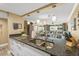 Open concept kitchen with granite countertops looking into living area at 4505 S Atlantic Ave # 505, Ponce Inlet, FL 32127