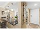 Bright, white kitchen with granite countertops conveniently near entryway at 4505 S Atlantic Ave # 505, Ponce Inlet, FL 32127