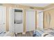Convenient laundry area with a stacked washer and dryer, adjacent to the guest bedroom at 4505 S Atlantic Ave # 505, Ponce Inlet, FL 32127