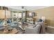 Comfortable living room features stylish seating and balcony access with ocean views at 4505 S Atlantic Ave # 505, Ponce Inlet, FL 32127