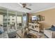 Bright living room with a sliding glass door leading to a balcony overlooking the ocean at 4505 S Atlantic Ave # 505, Ponce Inlet, FL 32127