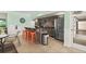 Inviting recreation room featuring a partial kitchen, bar-style seating, and stainless steel appliances for convenient community gatherings at 4505 S Atlantic Ave # 505, Ponce Inlet, FL 32127