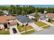 This aerial view shows the house with its well-kept lawn and landscaping in a neighborhood with mature trees at 4534 Bond Ln, Oviedo, FL 32765