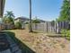 Fenced backyard offering privacy and shade from a mature palm tree at 4534 Bond Ln, Oviedo, FL 32765