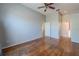 Bedroom with hardwood floors and multiple entryways at 4534 Bond Ln, Oviedo, FL 32765