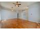Spacious living room featuring hardwood floors, light gray walls, and modern lighting fixtures at 4534 Bond Ln, Oviedo, FL 32765
