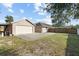 Large backyard with a detached garage and plenty of space for outdoor activities at 481 W Holly Dr, Orange City, FL 32763