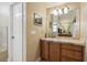 Bathroom featuring a vanity and a view of the separate shower and tub area at 481 W Holly Dr, Orange City, FL 32763