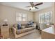 Bedroom featuring a desk, sleeper sofa, ceiling fan and a window providing natural light at 481 W Holly Dr, Orange City, FL 32763