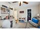 Bedroom with desk, shelves, and a couch, offering a multifunctional living space at 481 W Holly Dr, Orange City, FL 32763