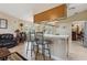 The breakfast bar connects the kitchen and living room at 481 W Holly Dr, Orange City, FL 32763