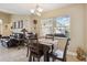 Cozy dining room area open to living room features neutral paint, tile floors, and natural light at 481 W Holly Dr, Orange City, FL 32763