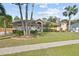 Beautiful single-story home with lush lawn and mature trees providing a serene setting at 481 W Holly Dr, Orange City, FL 32763