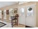 Bright foyer featuring tiled floors, arched windows, and a stylish seating area at 481 W Holly Dr, Orange City, FL 32763