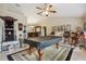 Open game room and bar featuring a pool table, barstool seating, and ample space for entertaining at 481 W Holly Dr, Orange City, FL 32763
