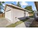 Garage exterior with a view of attached patio at 481 W Holly Dr, Orange City, FL 32763