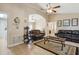 Open living room with tile floors, comfortable seating, and decorative accents at 481 W Holly Dr, Orange City, FL 32763