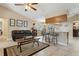 Bright living space featuring tile floors, neutral paint, and seamlessly blends into the breakfast bar at 481 W Holly Dr, Orange City, FL 32763