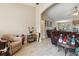 Open living space with tile floors is adjacent to a dining area and sitting area and has neutral paint at 481 W Holly Dr, Orange City, FL 32763