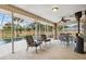 Inviting patio with shaded seating and a view of the serene swimming pool at 481 W Holly Dr, Orange City, FL 32763