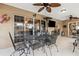 Covered patio with elegant wrought iron furniture, offering a perfect spot for outdoor dining and relaxation at 481 W Holly Dr, Orange City, FL 32763