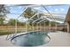 Inviting screened-in pool with water feature, perfect for relaxation and entertaining at 481 W Holly Dr, Orange City, FL 32763